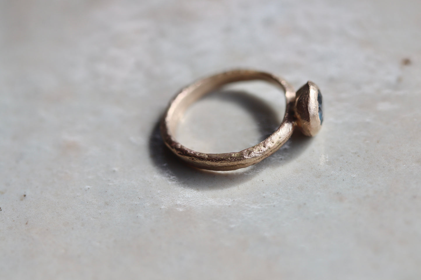 rustic earthy montana sapphire solitaire ring sandcast organic wabi sabi engagement ring blue rganic texture .5ct 1.ct ethical sustainable paige devlin jewelry earthy rustic nature inspired lavender textured