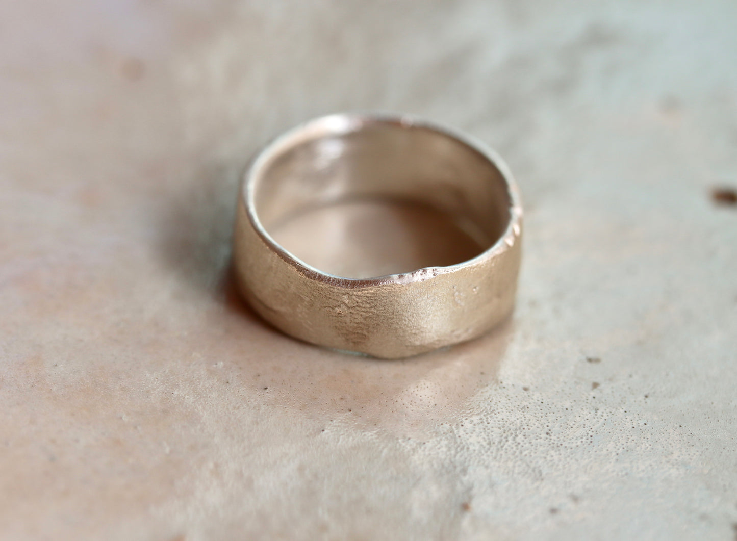 sandcast wide sterling silver wedding band mens rustic textured wide band ring paige devlin jewelry organic wabi sabi