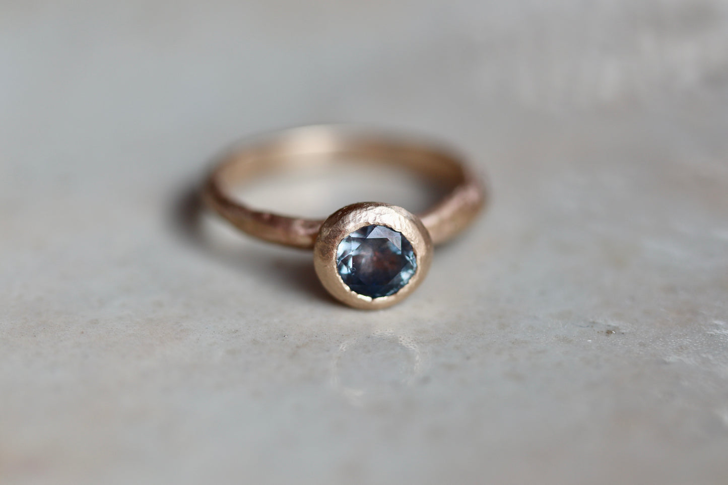 rustic earthy montana sapphire solitaire ring sandcast organic wabi sabi engagement ring blue rganic texture .5ct 1.ct ethical sustainable paige devlin jewelry earthy rustic nature inspired lavender textured