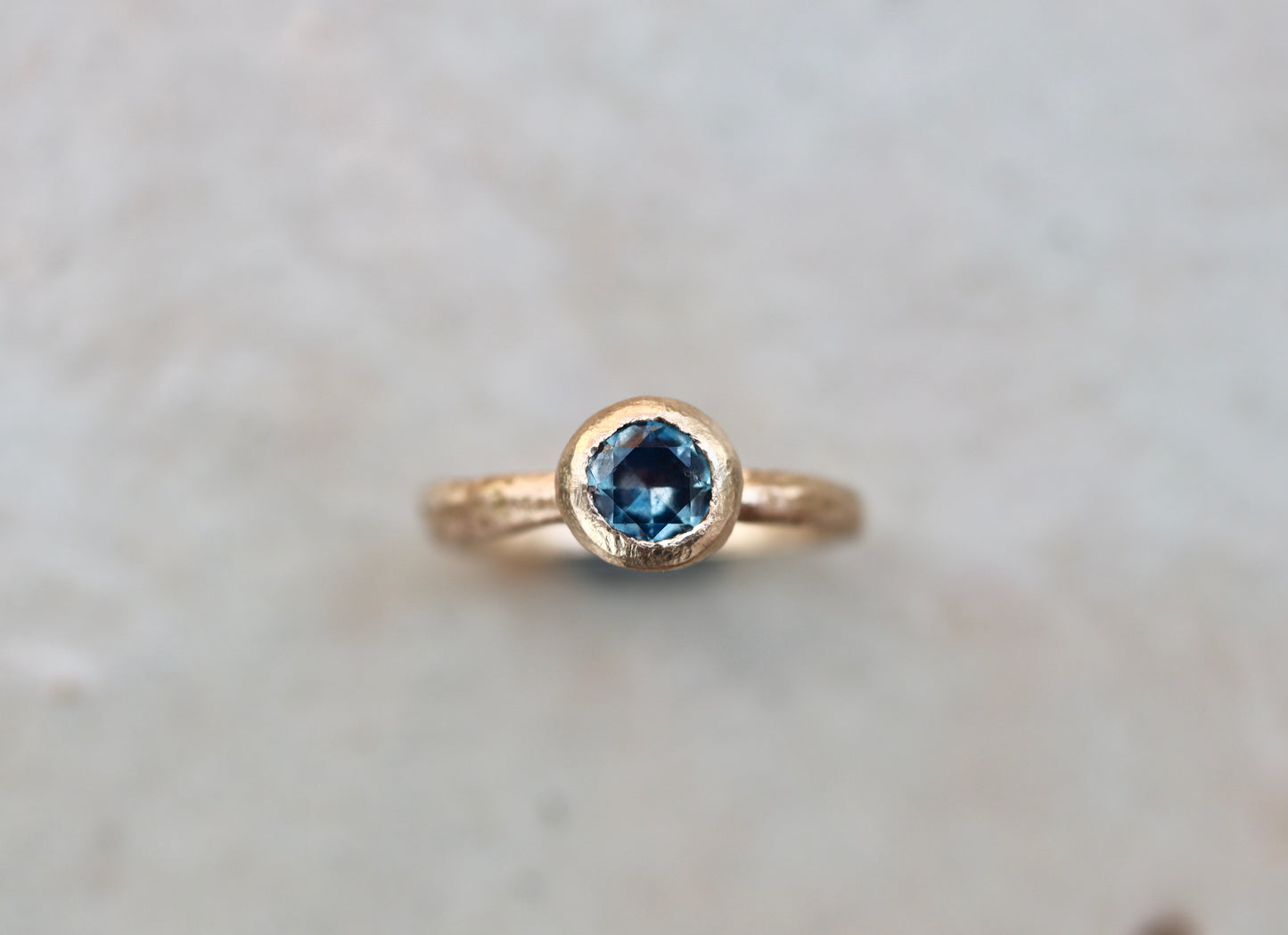 rustic earthy montana sapphire solitaire ring sandcast paige devlin jewelry organic wabi sabi engagement ring