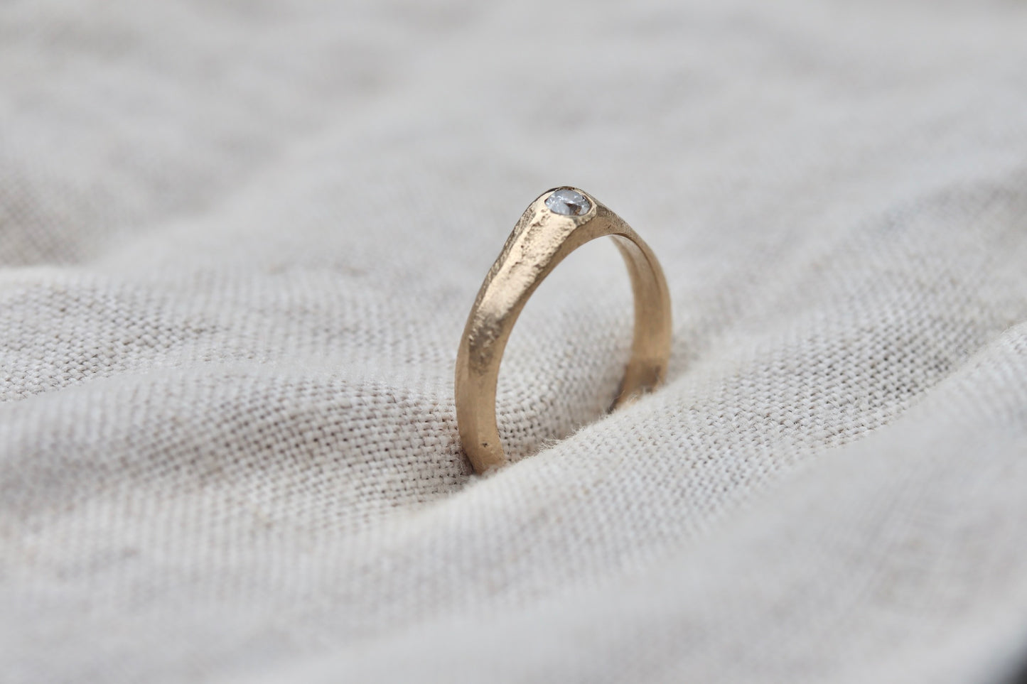 ethical diamond engagement solitaire ring reclaimed diamond sandcast recycled diamond recycled gold sustainable diamond ring earthy diamond ring organic texture diamond ring paige devlin jewelry low profile gold diamond organic rustic dainty signet