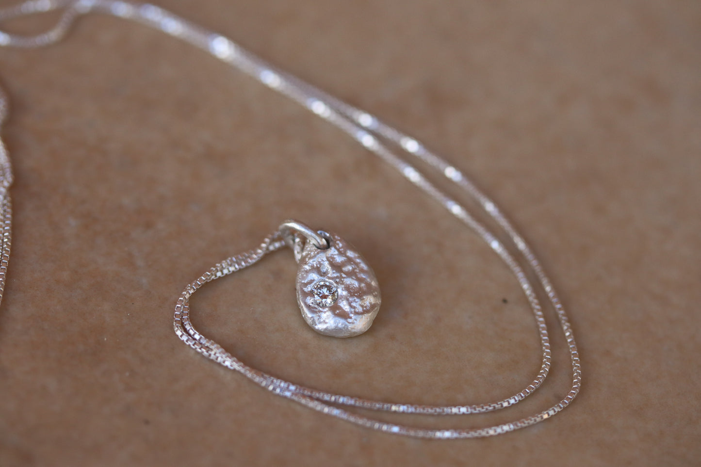 ethical diamond organic texture sandcast small petite necklace paige devlin jewelry minimal organic pendant