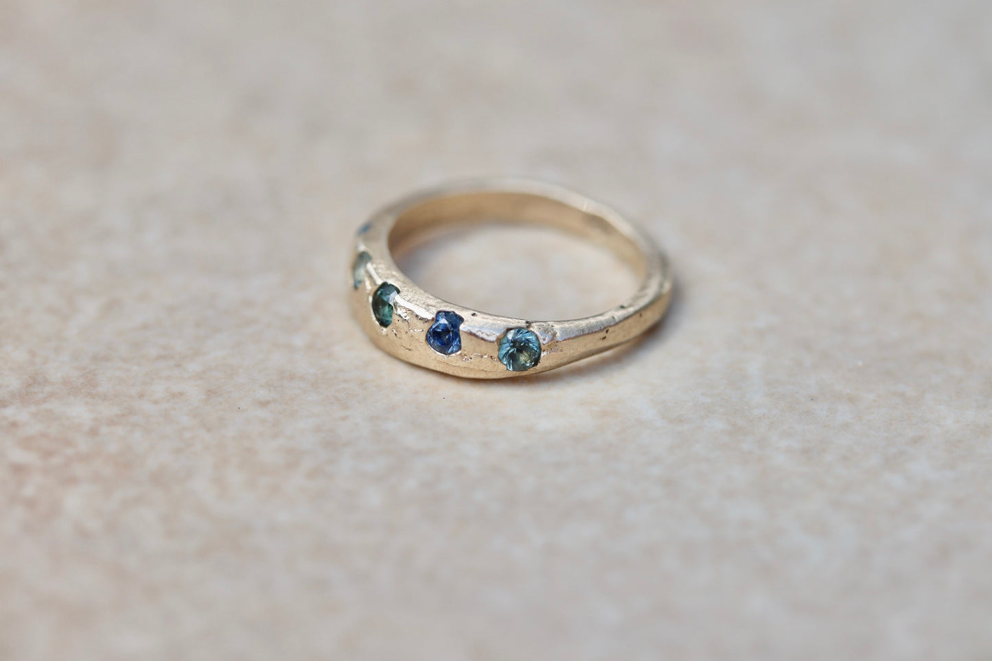 montana sapphire organic texture sandcast rustic ethical wedding band paige devlin jewelryblue green montana sapphire unity eternity ring
