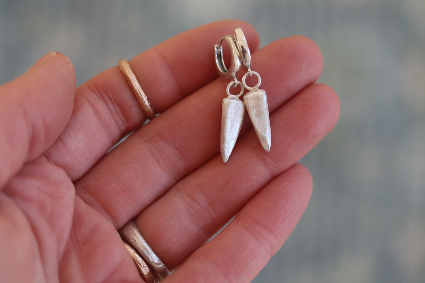 sandcast organic hoops silver handmade rose thorn earrings dagger spear