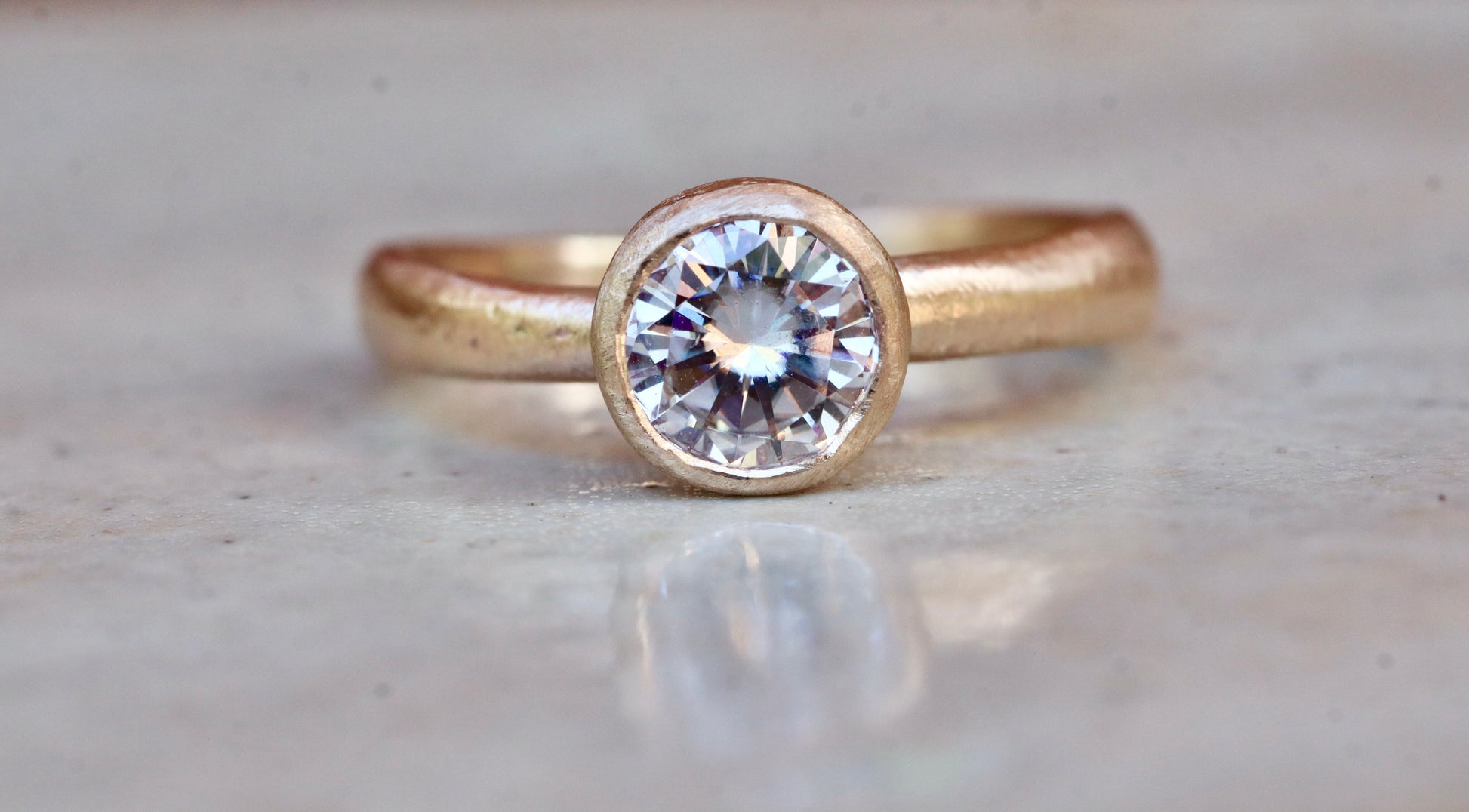 solitaire 1ct ethical diamond earthy organic texture sandcast wedding engagement ring paige devlin methow valley washington wedding jeweler alternative unique nature inspired ring 14kt recycled gold artisan handcrafted