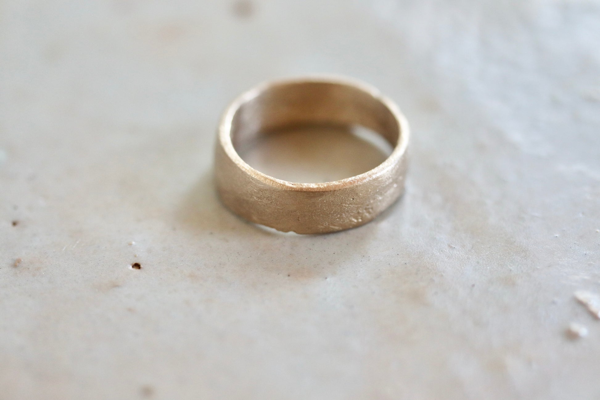 sandcast wide organic wedding band recycled 14kt gold paige devlin jewelry rustic mens band organic texture thick earthen earthy 