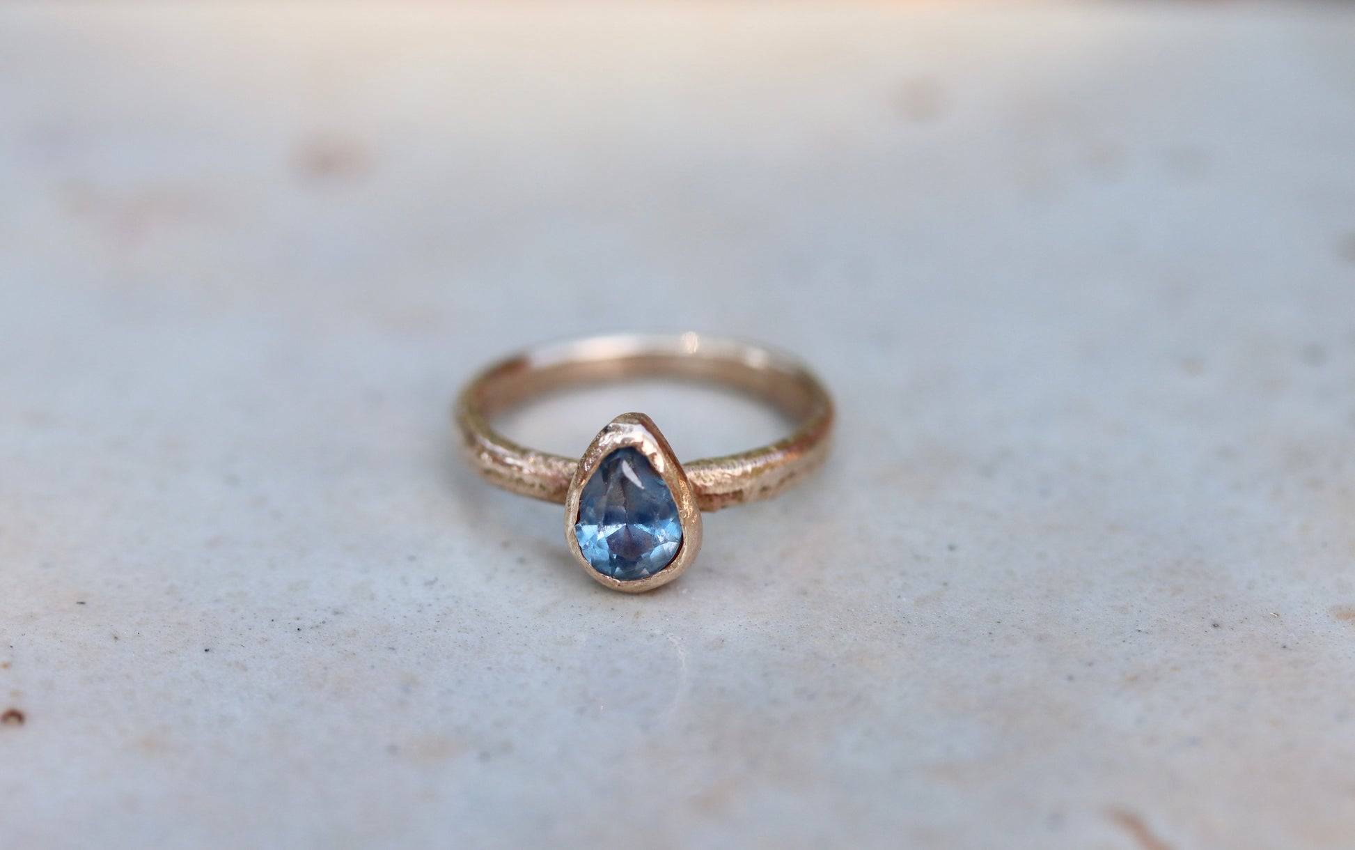 blue pear montana sapphire organic texture sandcast .5ct 1.ct engagement solitaire ring band ethical sustainable paige devlin jewelry earthy rustic  nature inspired lavender textured