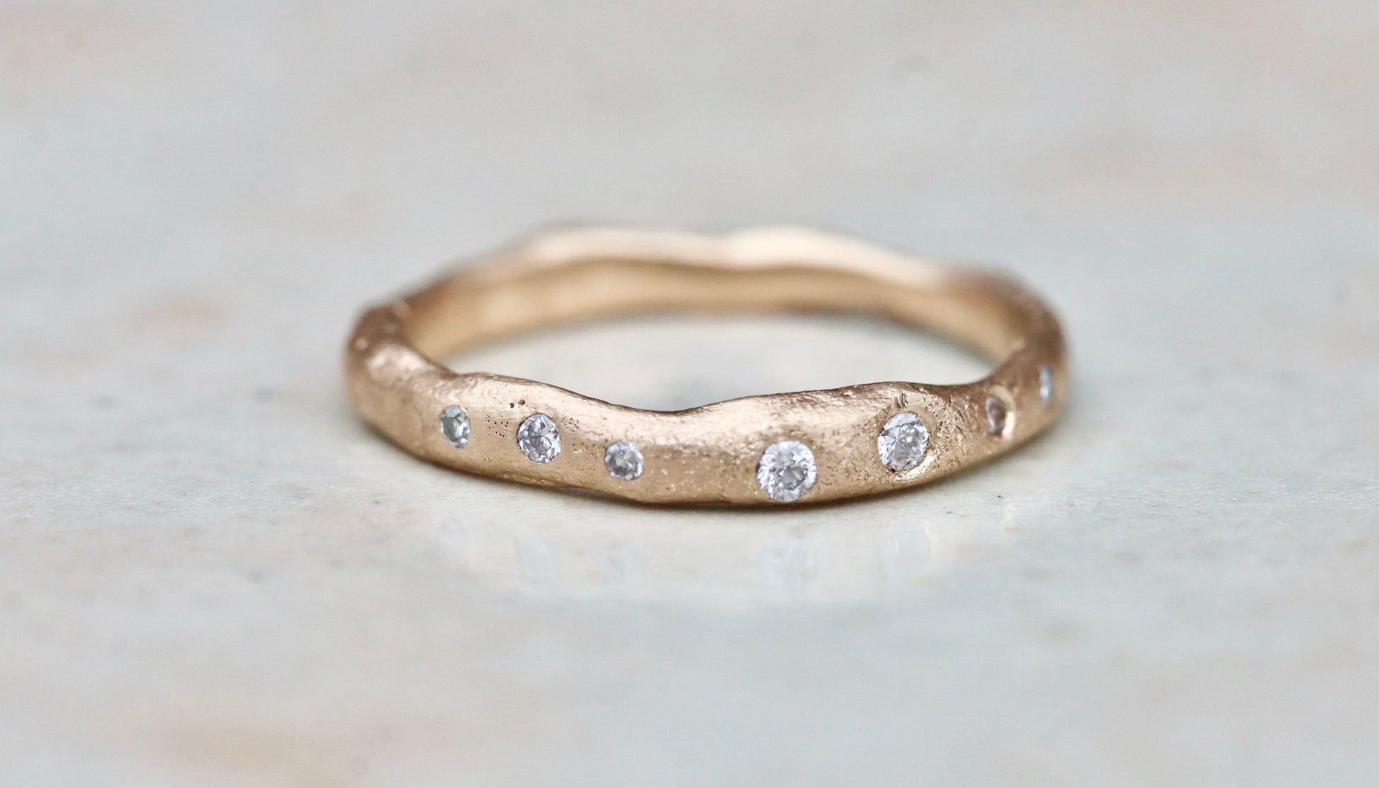rustic organic gold 14kt sandcast ethical reclaimed scattered diamonds paige devlin jewelry wedding band ring wabi sabi rustic