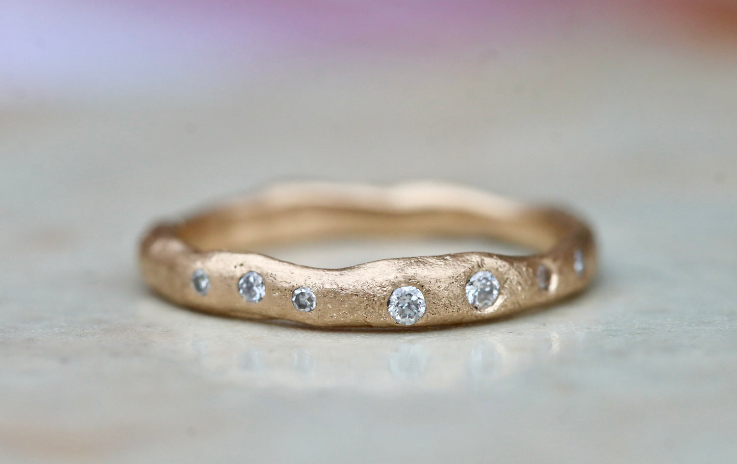 rustic organic gold 14kt sandcast ethical reclaimed scattered diamonds paige devlin jewelry wedding band ring wabi sabi rustic celestial