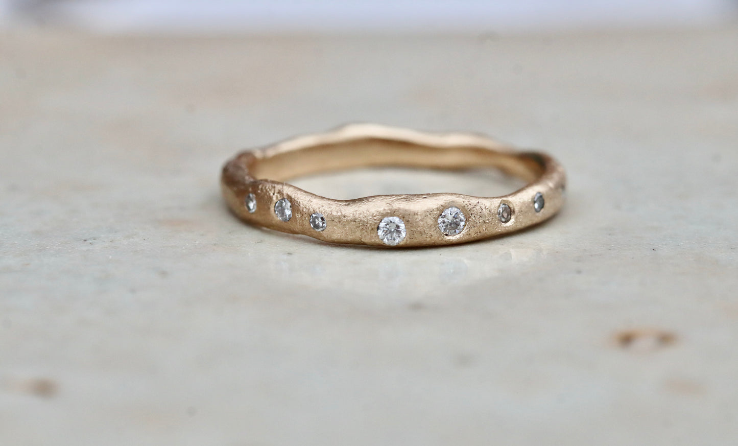 rustic organic sandcast ethical reclaimed scattered diamonds paige devlin jewelry wedding band ring wabi sabi rustic organic gold band celestial