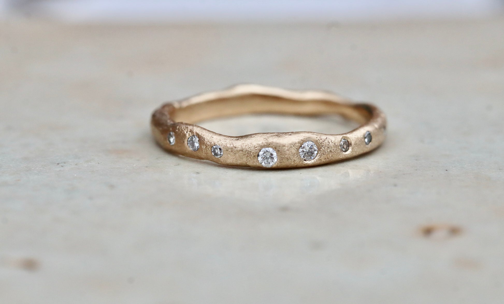 rustic organic sandcast ethical reclaimed scattered diamonds paige devlin jewelry wedding band ring wabi sabi rustic organic gold band celestial