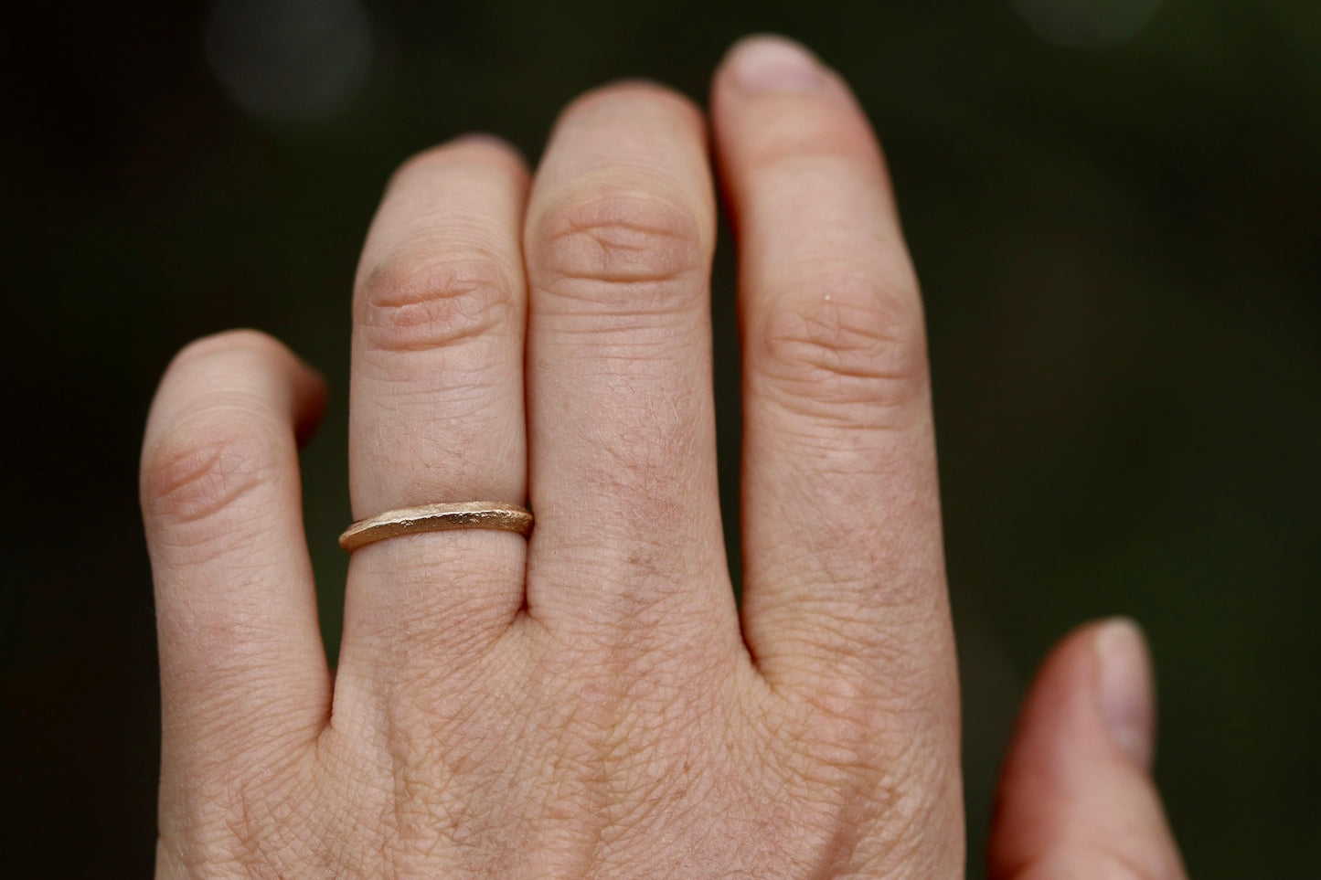 thin organic peaked wedding band 14kt recycled gold sandcast