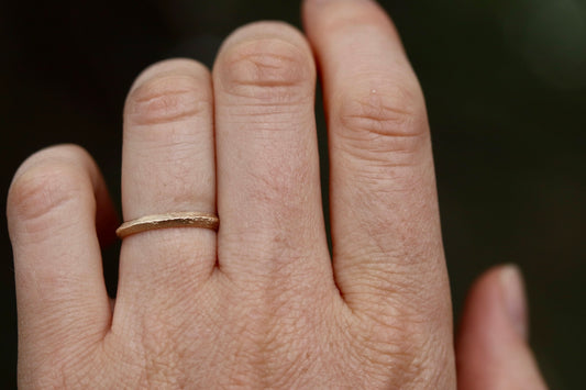 thin organic peaked wedding band 14kt recycled gold sandcast