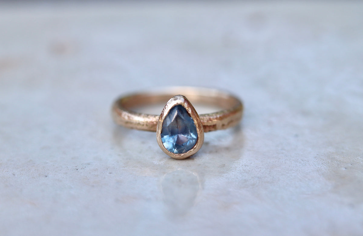blue pear montana sapphire organic texture sandcast .5ct 1.ct engagement solitaire ring band ethical sustainable paige devlin jewelry earthy rustic  nature inspired lavender textured