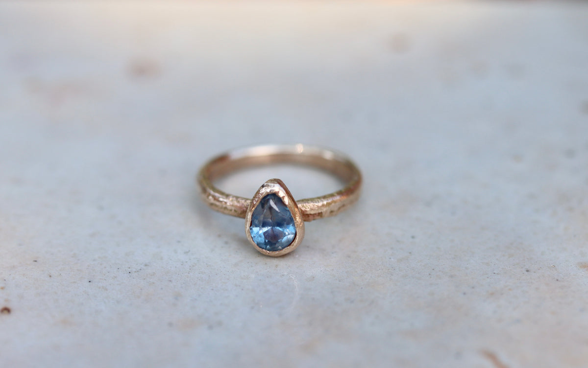 blue pear montana sapphire organic texture sandcast .5ct 1.ct engagement solitaire ring band ethical sustainable paige devlin jewelry earthy rustic  nature inspired lavender textured