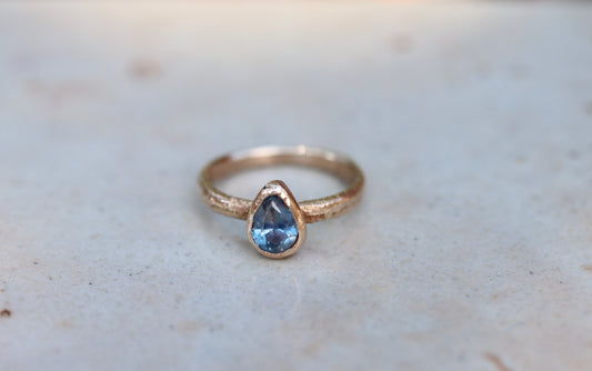 blue pear montana sapphire organic texture sandcast .5ct 1.ct engagement solitaire ring band ethical sustainable paige devlin jewelry earthy rustic  nature inspired lavender textured