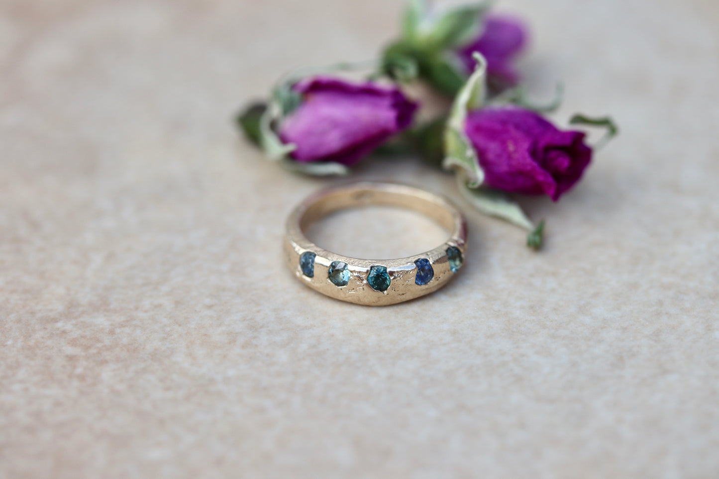 montana sapphire organic texture sandcast rustic ethical wedding band paige devlin jewelry blue green montana sapphire unity eternity ring