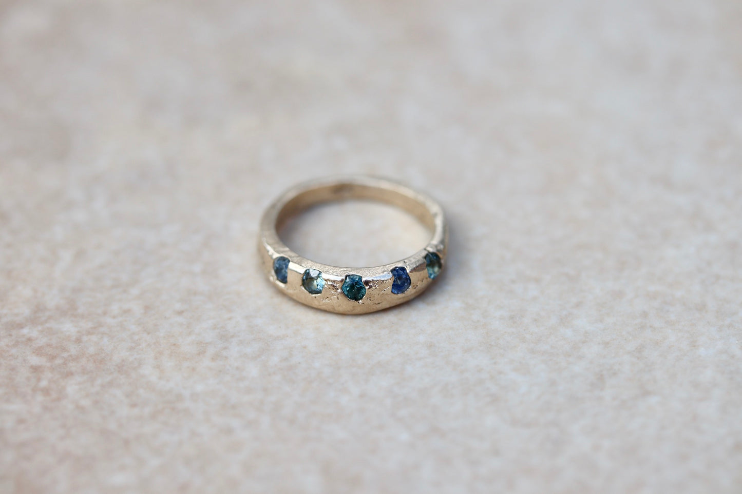 montana sapphire organic texture sandcast rustic ethical wedding band paige devlin jewelryblue green montana sapphire unity eternity ring