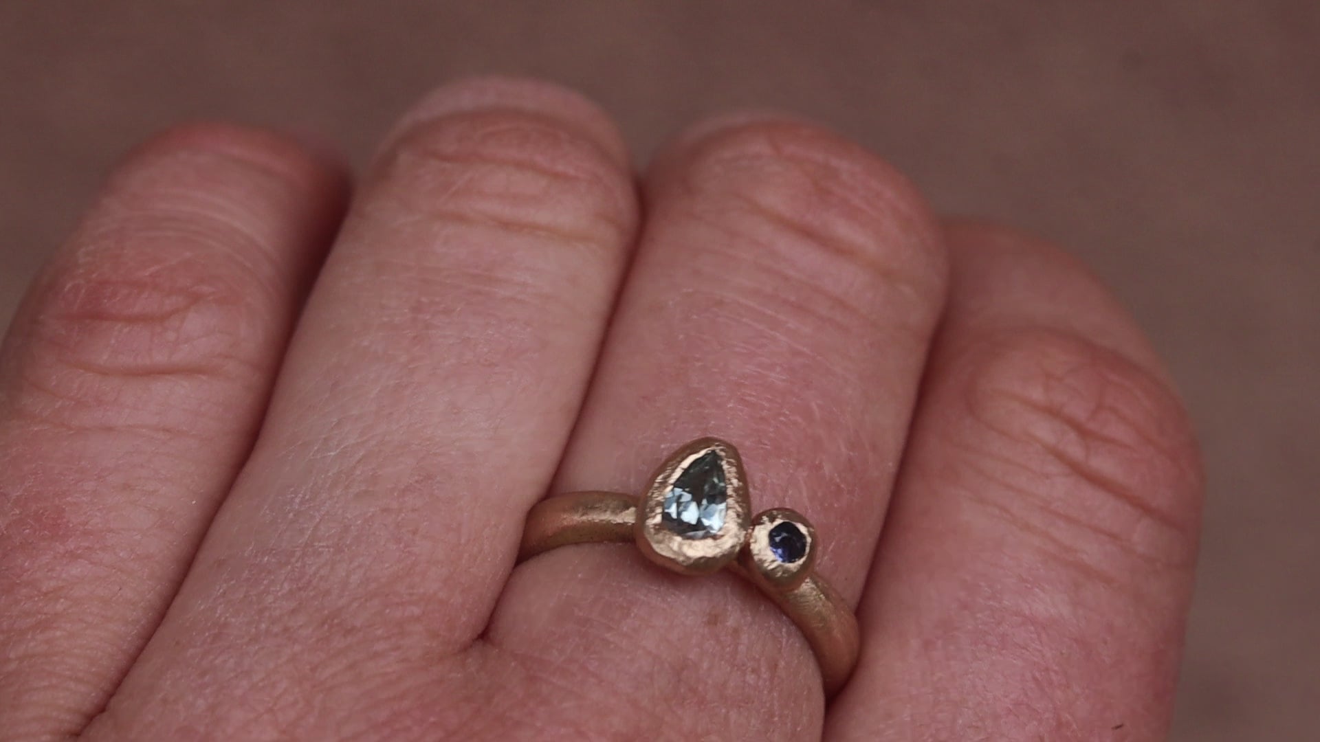 blue montana sapphire organic texture sandcast paige devlin jewelry 14kt gold handcrafted engagement ring pear shape yogo sapphire