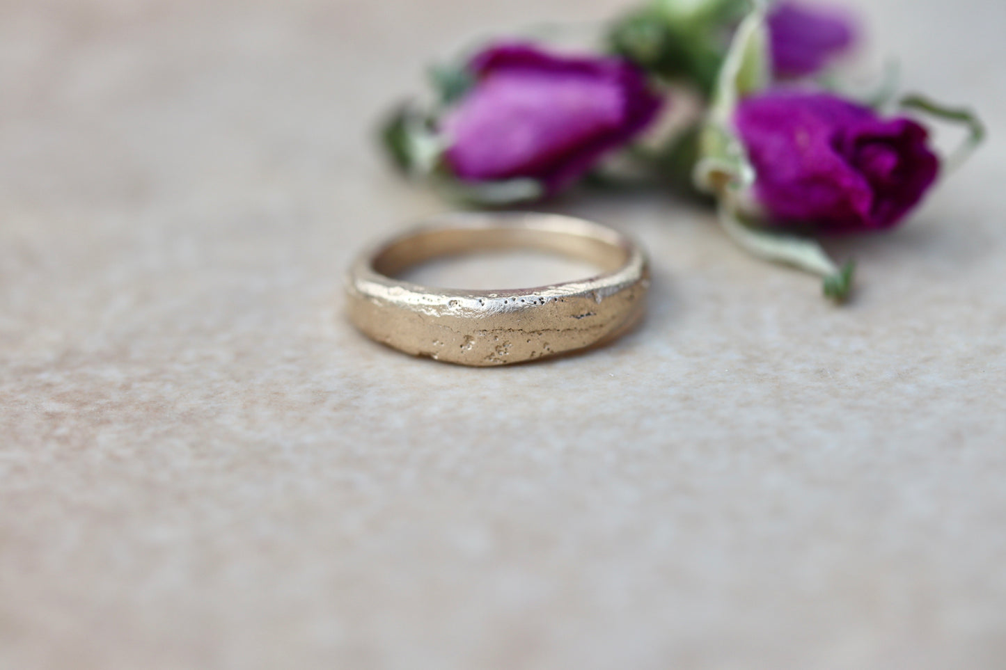 thin 14kt recycled gold  organic minimal texture sandcast wedding band ethical paige devlin jewelry methow valley wedding jewelry